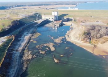 Aerial view Denison Dam low in water located on the Red River between Texas and Oklahoma. One of the largest America rolled, earth-filled dam impounds Lake Texoma in America